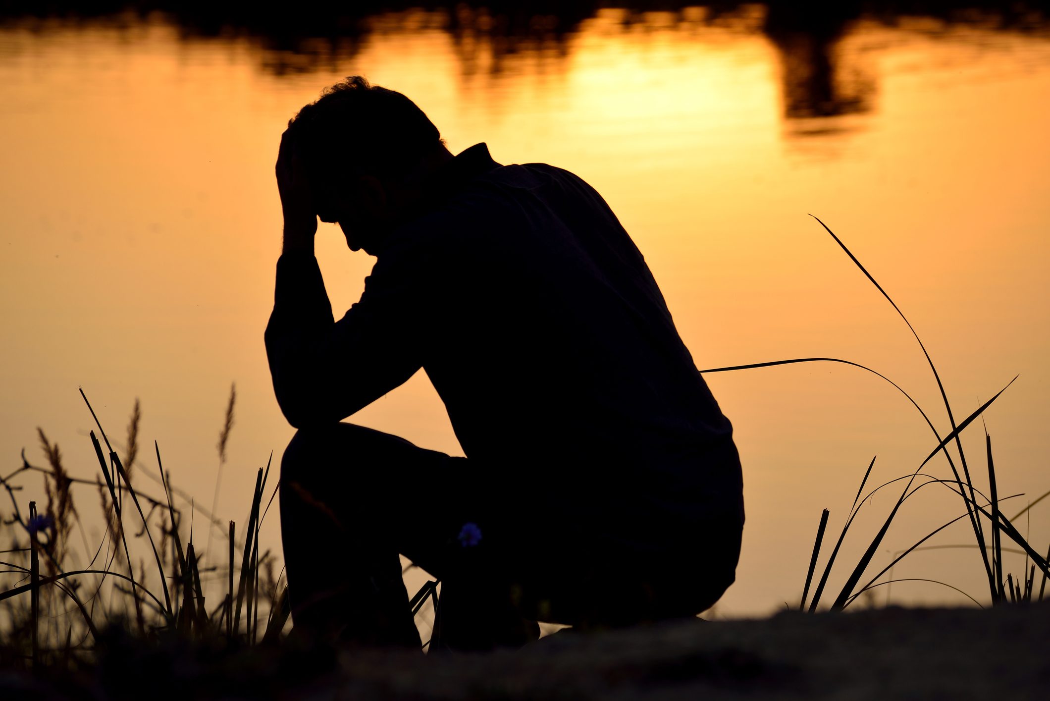 depressed-man-at-the-lake-8545700